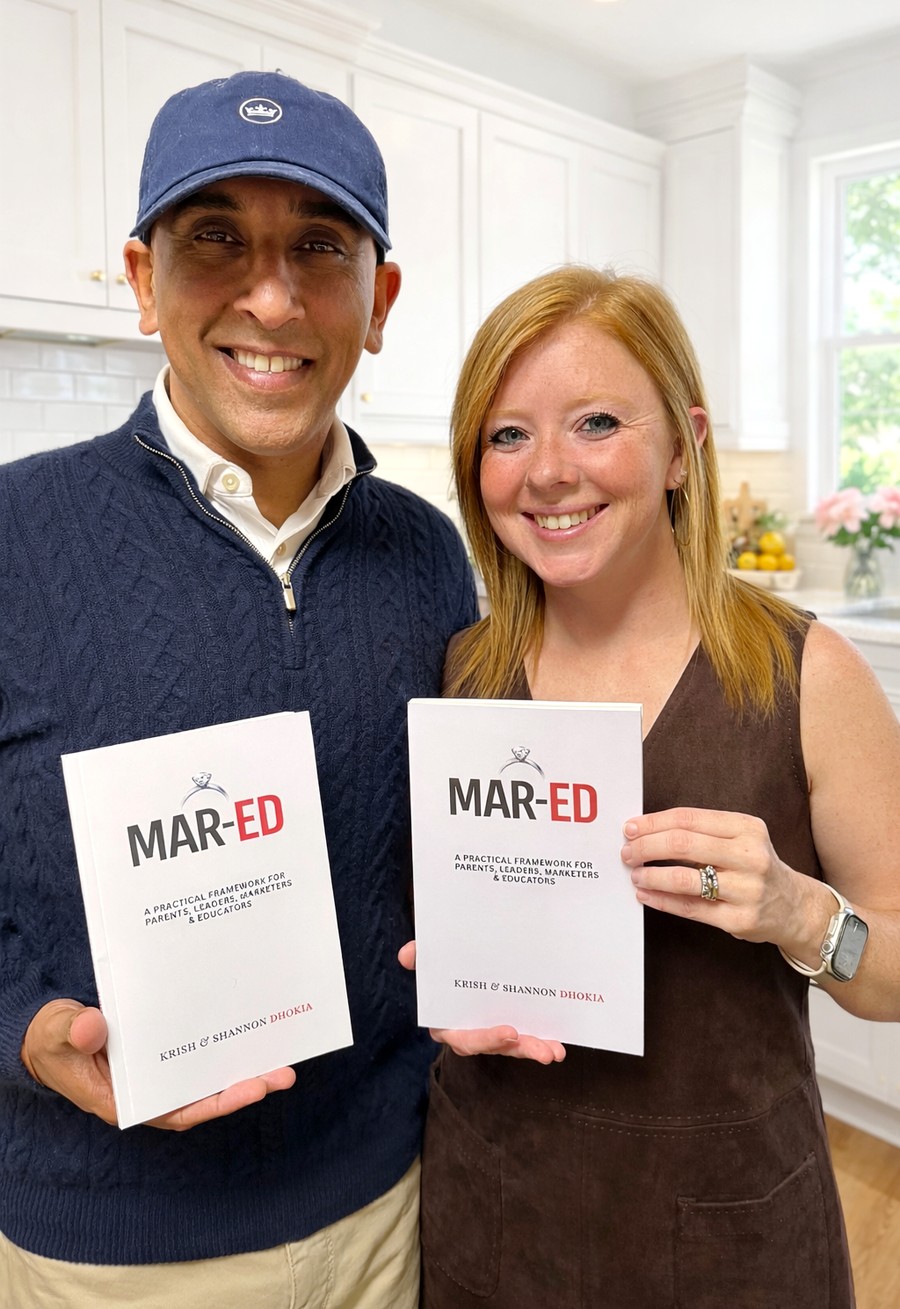 Krish and Shannon holding copies of their book, Mar-Ed